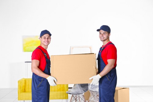 Moving team preparing a Camden flat removal with boxes and furniture