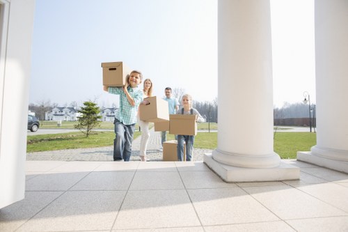 Camden moving team handling furniture and packed boxes