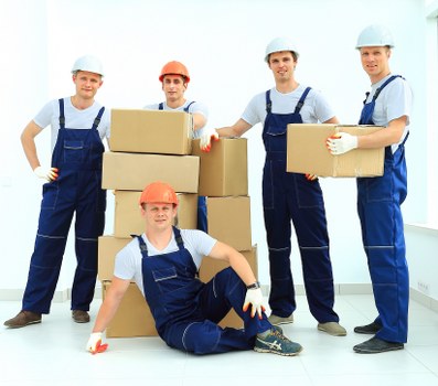 Office removal team planning a move in Camden with boxes and desks