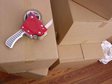 Loading furniture into a removal van in Camden