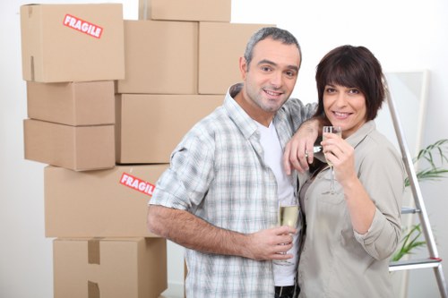 Professional movers handling stairs in a Camden apartment building