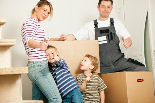 Moving boxes and household items in a Camden residential street